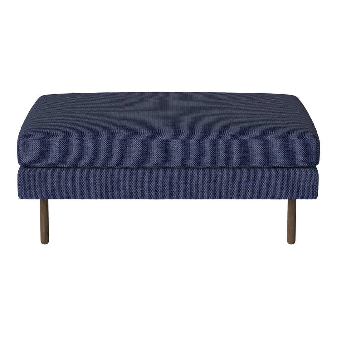 "Deep navy blue upholstered ottoman with textured fabric and sleek metal legs."