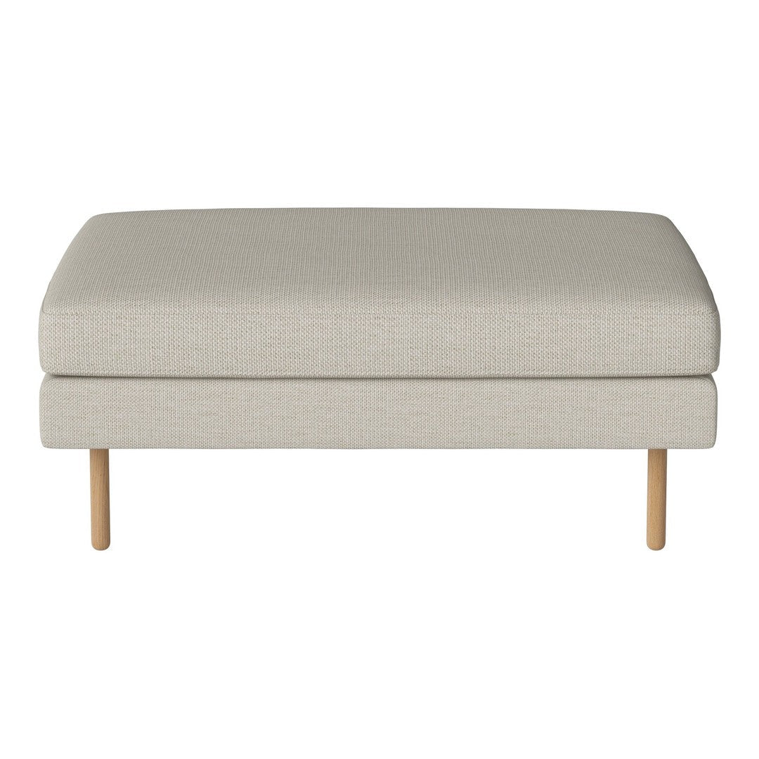 Light beige fabric ottoman with a simple, smooth surface and natural wood legs, perfect for minimalistic decor.