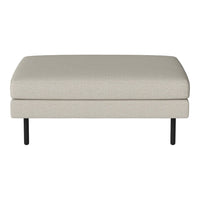 Light beige upholstered ottoman with a smooth finish, featuring sleek black legs for contemporary style.