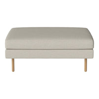 Light beige upholstered ottoman with a smooth texture and minimalist design, featuring wooden legs for a modern touch.