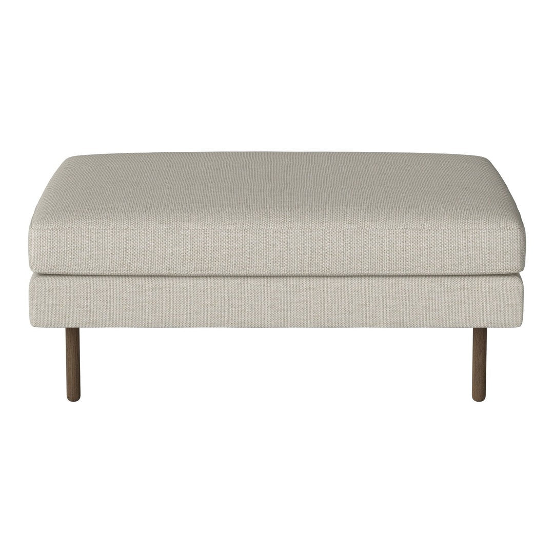 Neutral beige upholstered ottoman with a smooth texture and minimalist design, featuring sleek wooden legs.