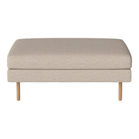 Beige upholstered ottoman with a smooth texture and wooden legs, ideal for modern living spaces.