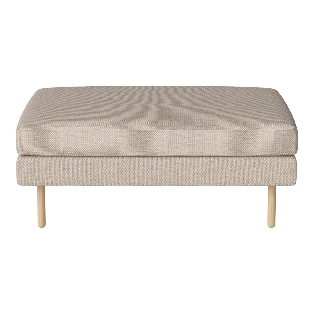Beige upholstered ottoman with a smooth texture and minimalist design, resting on wooden legs. Perfect for modern decor.