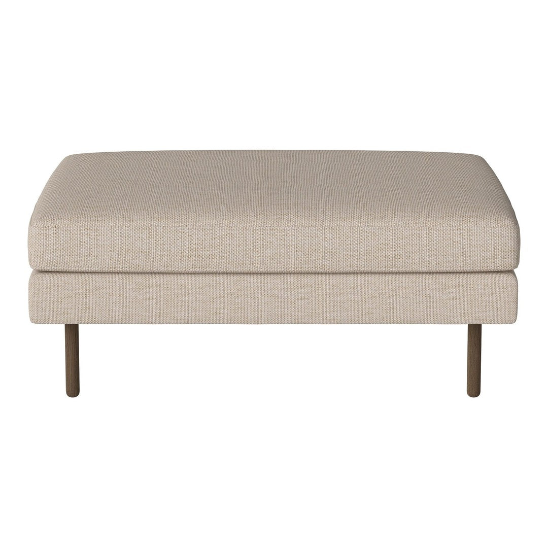 Beige upholstered ottoman with a smooth texture and sleek metal legs, perfect for modern decor.