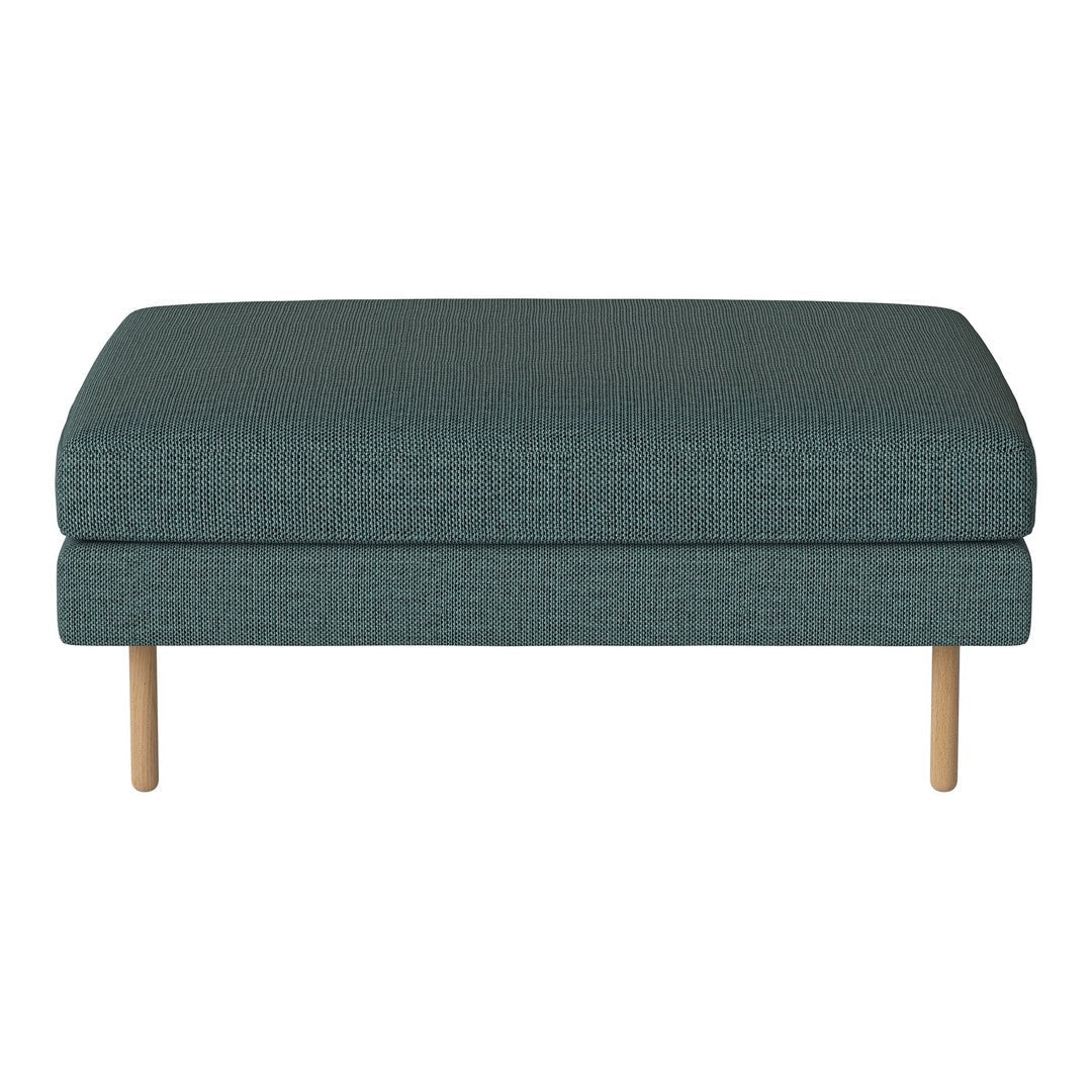 Teal upholstered ottoman with a textured pattern and light wood legs, perfect for modern decor.