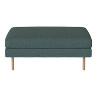 Teal upholstered ottoman with a textured pattern and light wood legs, perfect for modern decor.