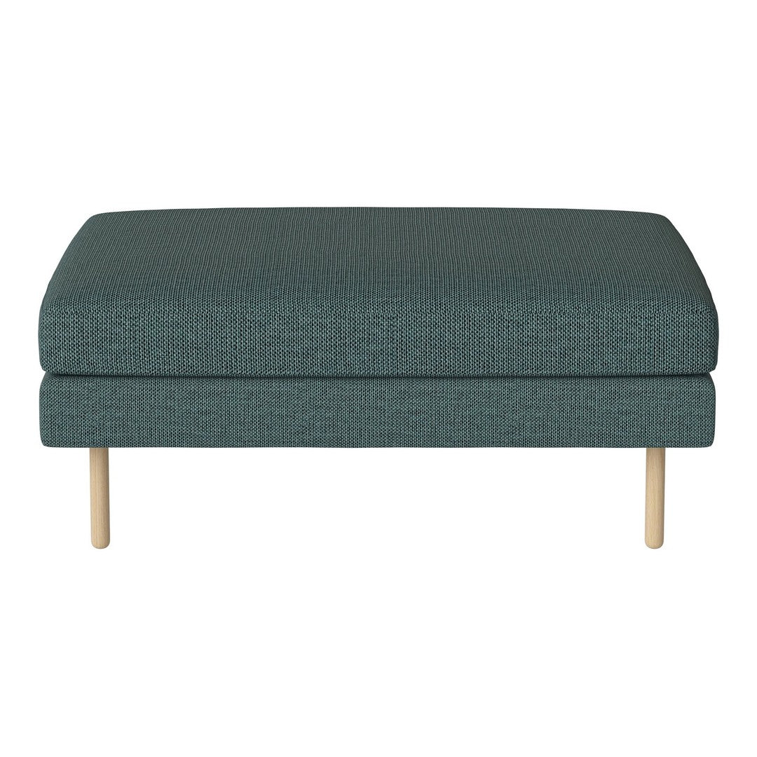 Teal upholstered ottoman with subtle texture and light wood legs, perfect for modern decor.