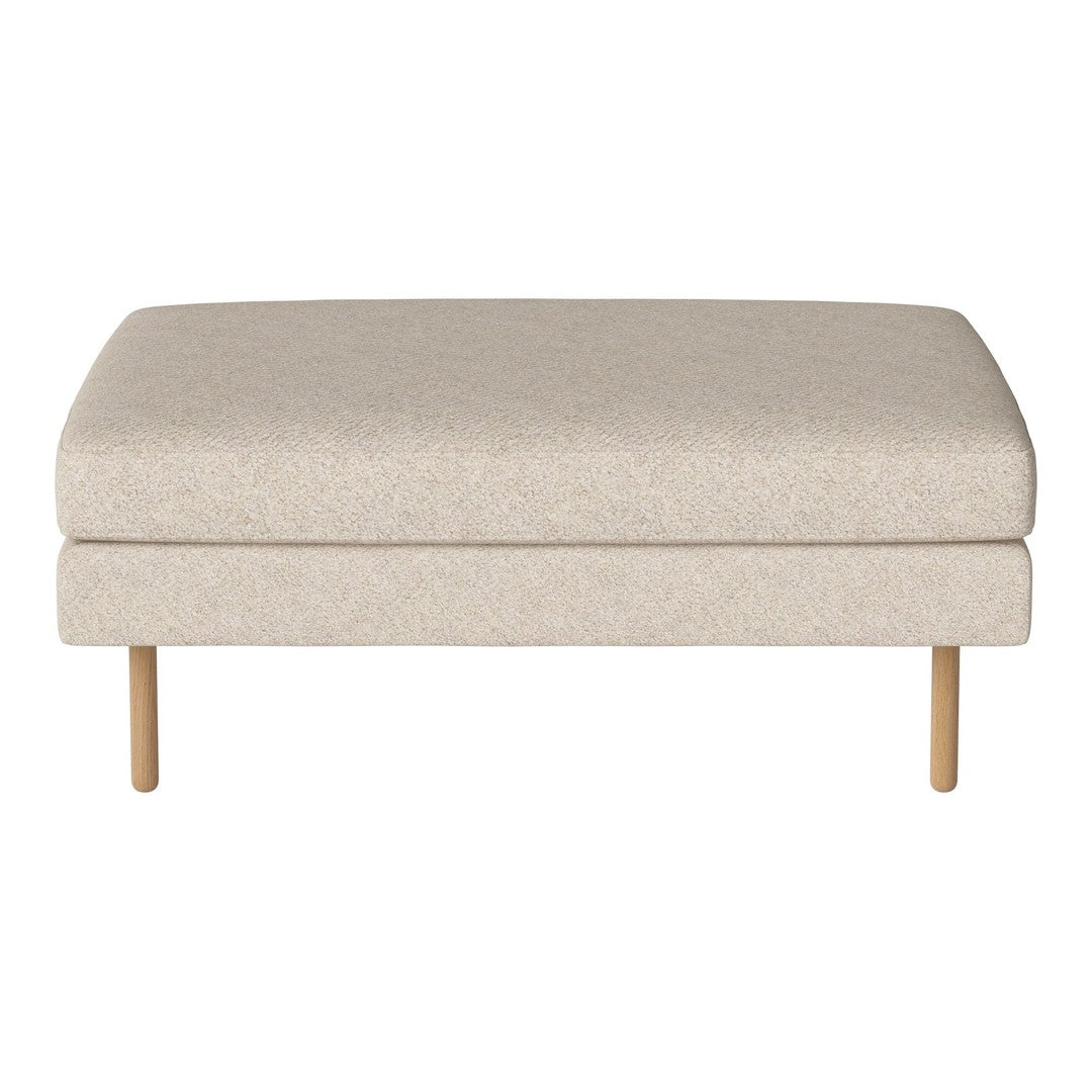 Light beige upholstered ottoman with subtle textured pattern and wooden legs. Perfect for neutral decor.