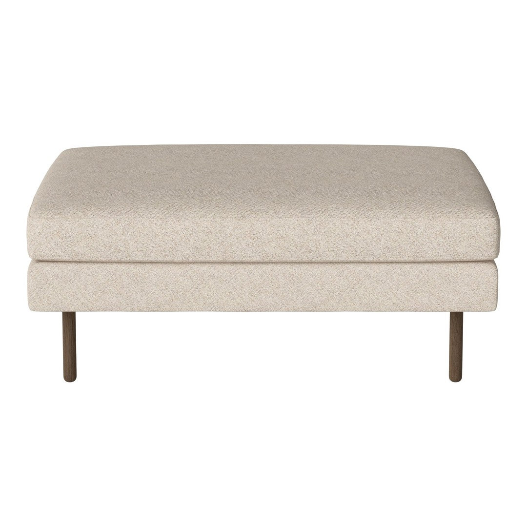 Beige upholstered ottoman with a smooth, solid surface and metal legs. Perfect for modern interiors.