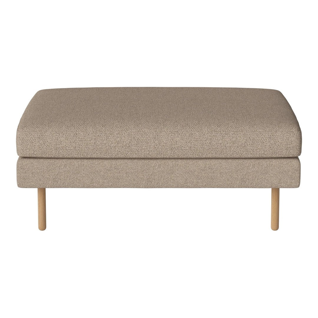 Beige upholstered ottoman with textured fabric and wooden legs, showcasing a simple, modern design.