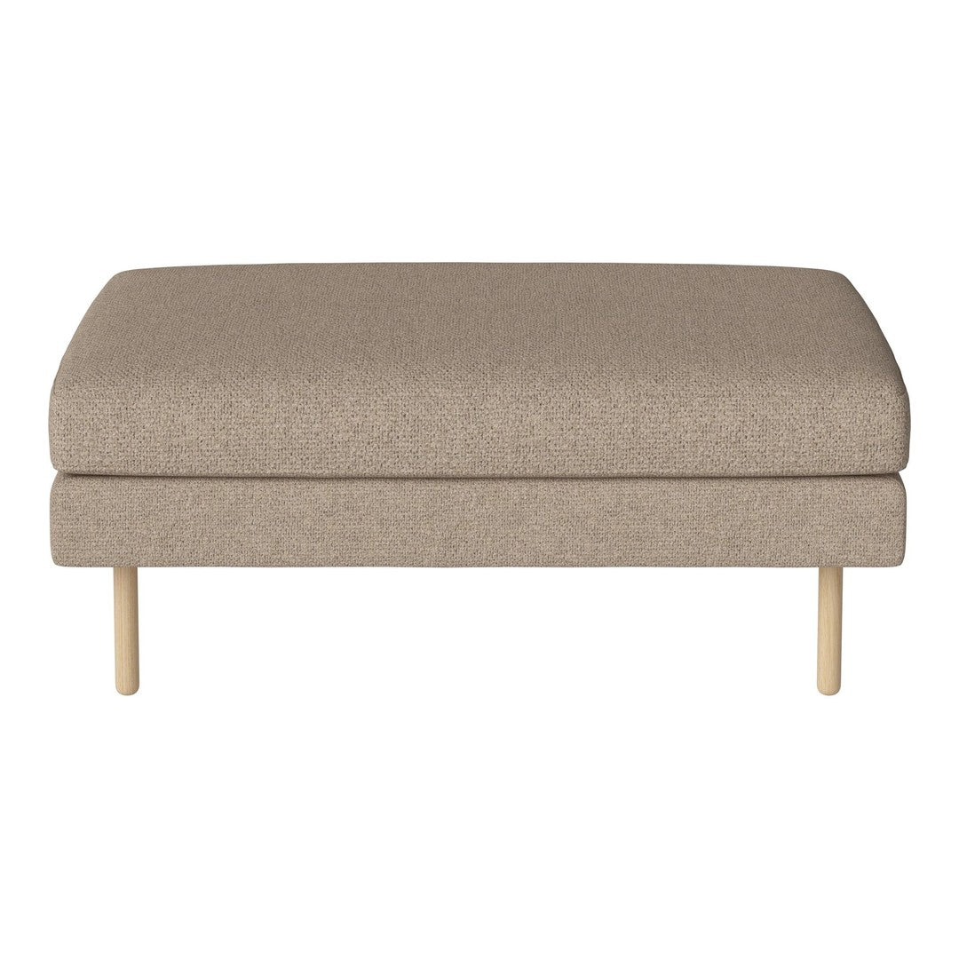 Beige fabric ottoman with a smooth texture and minimalist design, featuring wooden legs and a modern aesthetic.