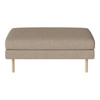Beige fabric ottoman with a smooth texture and minimalist design, featuring wooden legs and a modern aesthetic.
