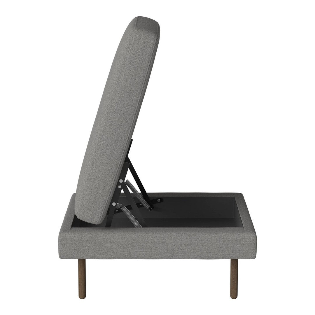Gray upholstered chair with a minimalist design and subtle texture, showcasing a sleek, modern silhouette.