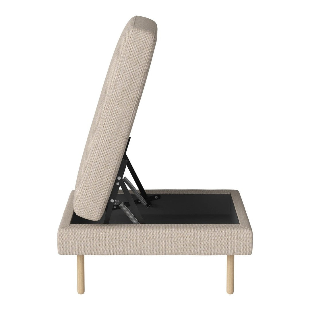 Beige upholstered chair with a sleek design, showcasing a textured fabric and minimalist wooden legs.