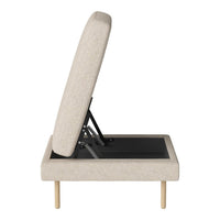 Beige upholstered sofa bed with a minimalist design and light wooden legs, showcasing a sleek, modern style.
