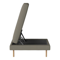 Gray upholstered adjustable bed frame with a sleek design and wooden legs, showcasing a minimalist modern pattern.