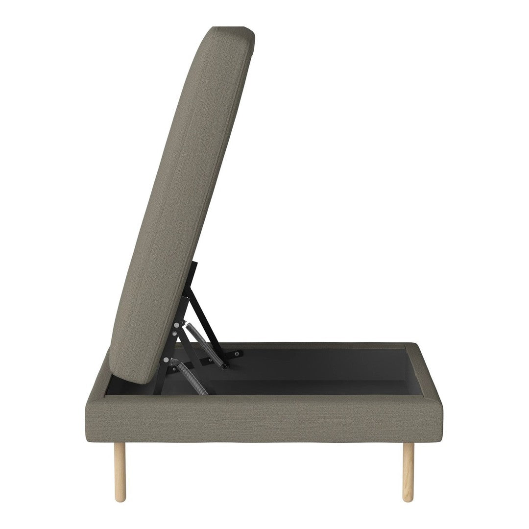 Gray upholstered adjustable bed frame with wooden legs and a minimalist design.