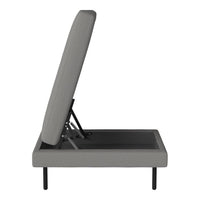 Gray upholstered bed frame with a sleek modern design and subtle ribbed pattern, featuring black metal legs.