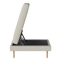 Light beige upholstered daybed with a smooth texture and minimalist design, featuring natural wooden legs.