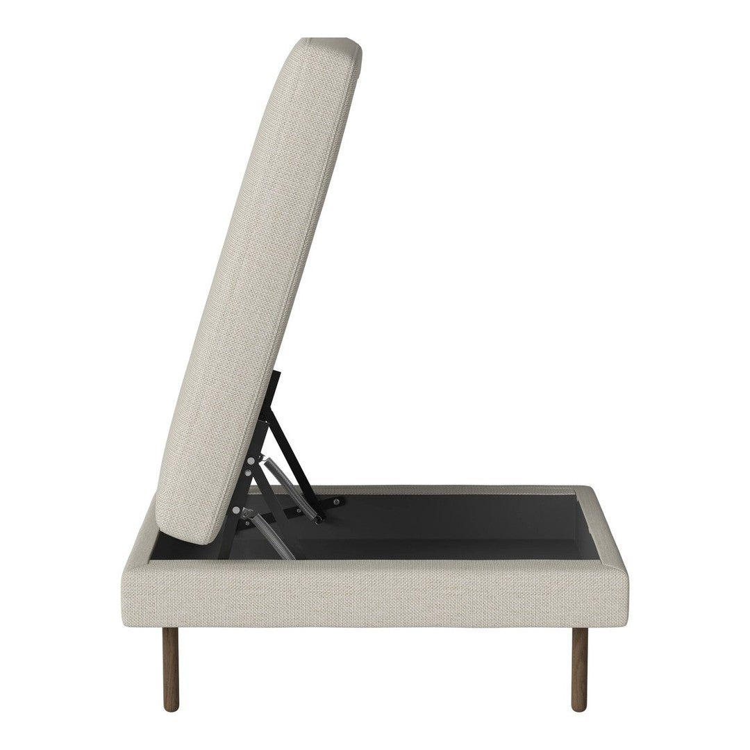 Light beige upholstered storage bed with a simple, modern design and a black base, featuring clean lines and no patterns.