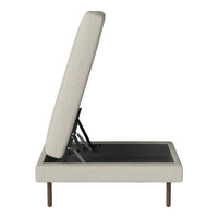 Light beige upholstered storage bed with a simple, modern design and a black base, featuring clean lines and no patterns.