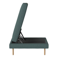 Teal textured upholstery with a modern pattern on a sleek, black base and light wooden legs.