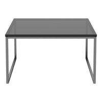 Modern square table with a sleek black glass top and minimalist silver metal frame, perfect for contemporary decor.