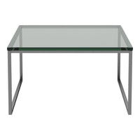 Modern glass coffee table with a sleek silver frame and clear top, designed for a minimalist aesthetic.