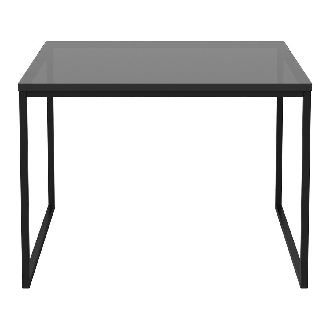 Black metal frame with a sleek, smooth gray glass tabletop, perfect for modern decor.