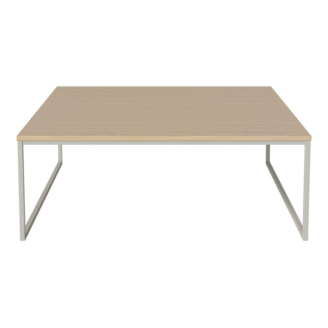 Light wood tabletop with a smooth finish, featuring a simple beige color, supported by sleek silver metal legs.