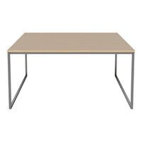 Light wood tabletop with a smooth finish and minimalist gray metal legs, perfect for modern decor.