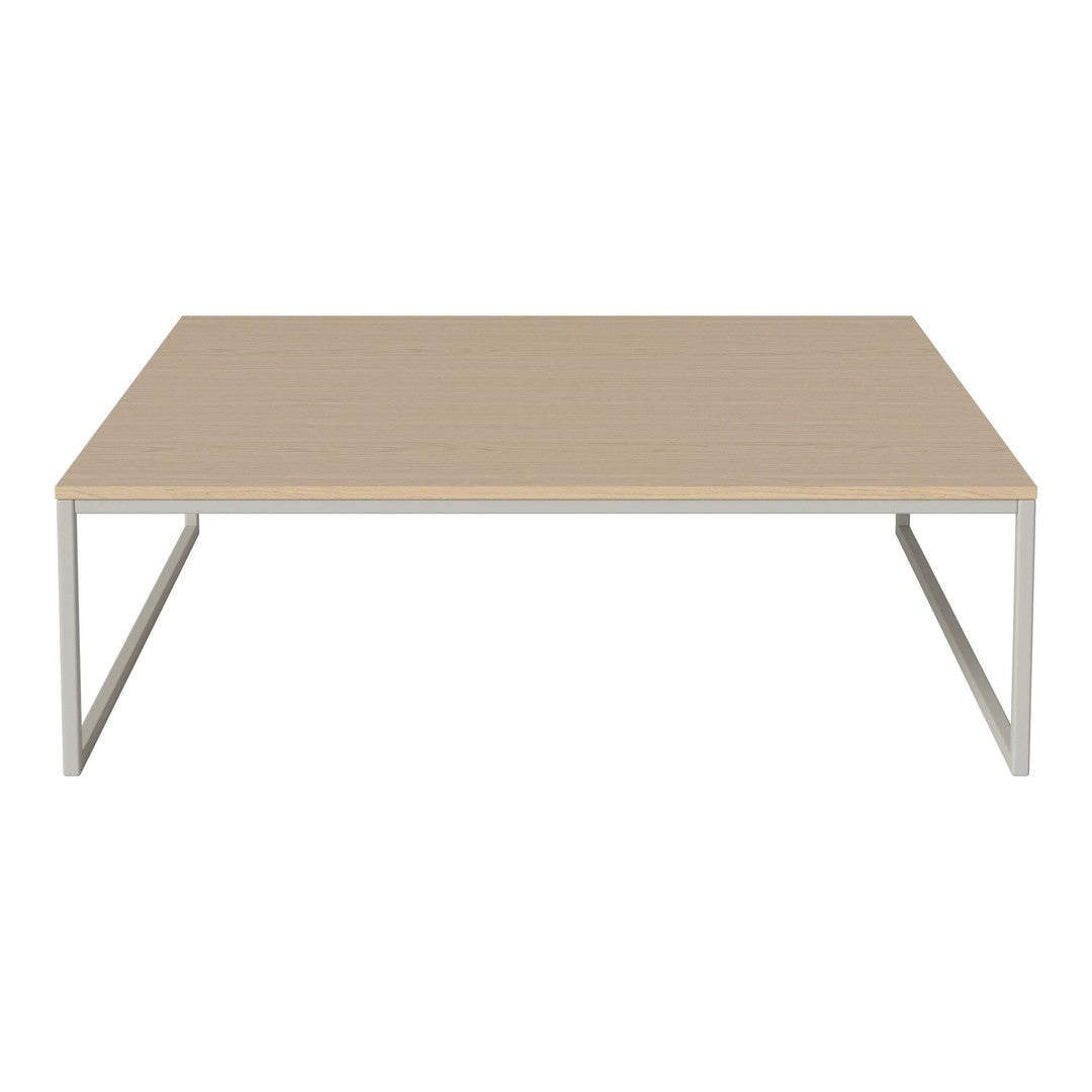 Light wood coffee table with a smooth surface and minimalist silver metal legs. Modern design, neutral color palette.