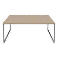 Light beige tabletop with a sleek, minimalistic design and silver metallic legs. Modern, versatile style for any space.