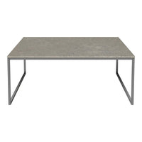 Gray concrete tabletop with a smooth, matte finish, featuring sleek silver metal legs in a minimalist design.