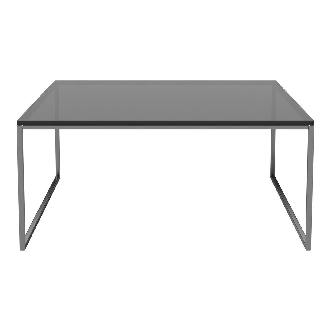 Sleek rectangular table with a smoky glass surface and minimalist metallic frame in silver. Modern and elegant design.