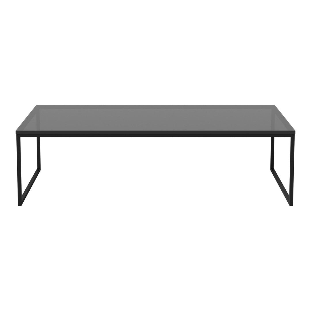 Modern black coffee table with a sleek gray glass top, minimalistic design and clean lines for contemporary decor.