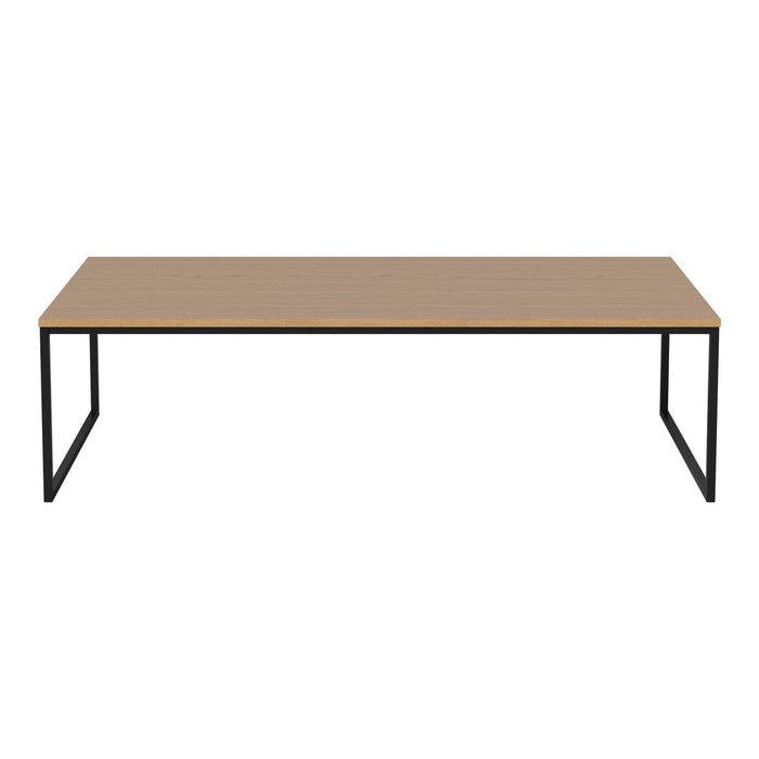 Modern rectangular coffee table with a light wood top and sleek black metal legs. Minimalist design, no patterns.