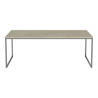 "Light gray tabletop with a smooth finish and metal legs in a sleek silver tone."