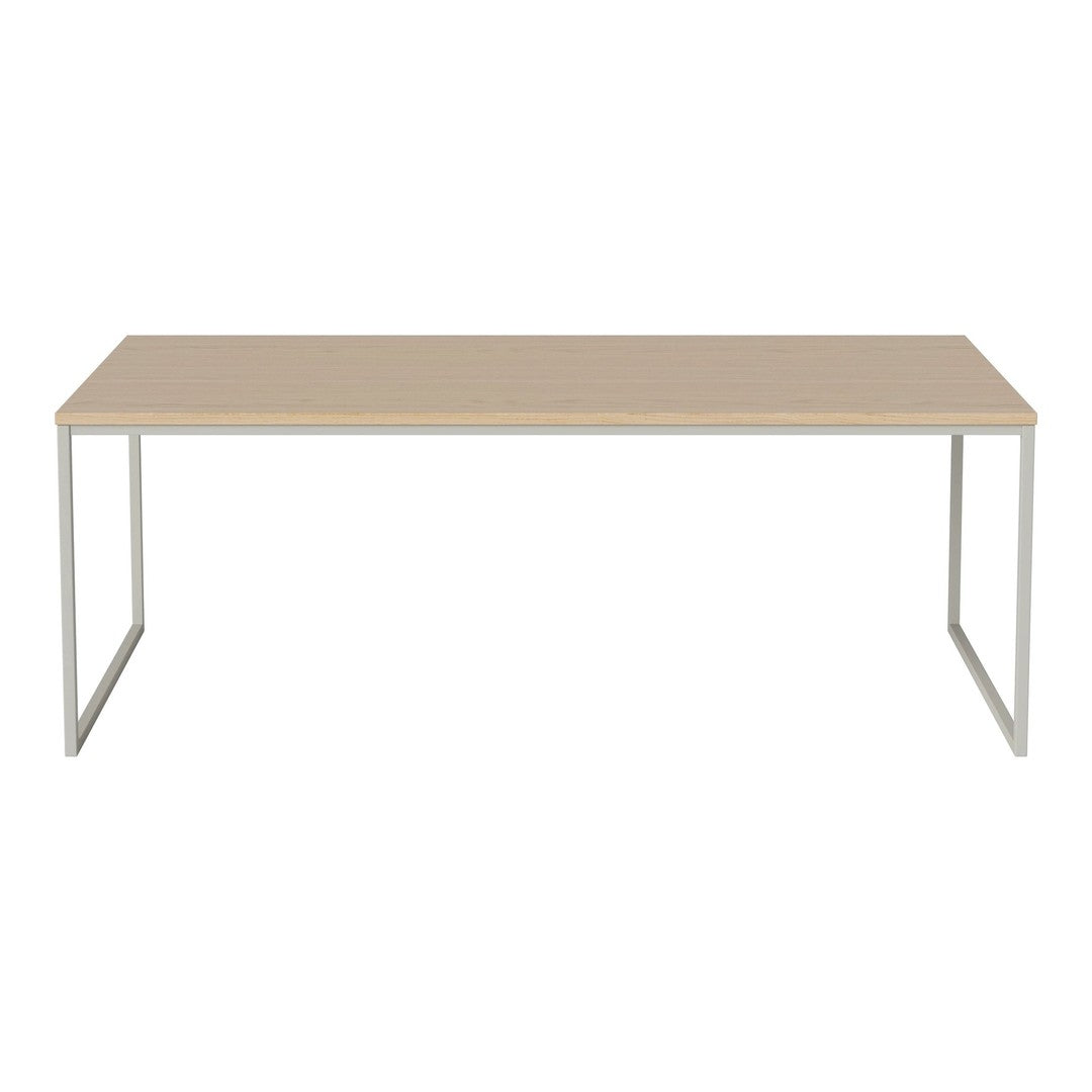 Light beige tabletop with a minimalist design and sleek silver legs, perfect for modern decor.