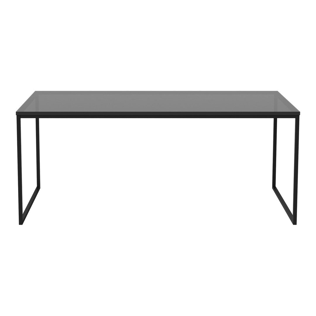 Modern black metal desk with a sleek gray glass top, featuring a minimalist design.