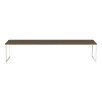 Long rectangular table with a dark wood finish and sleek white metal legs, perfect for modern decor.