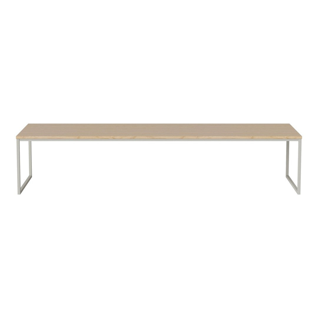 Long beige tabletop with a sleek white metal frame, offering a modern, minimalist design. Ideal for any space.