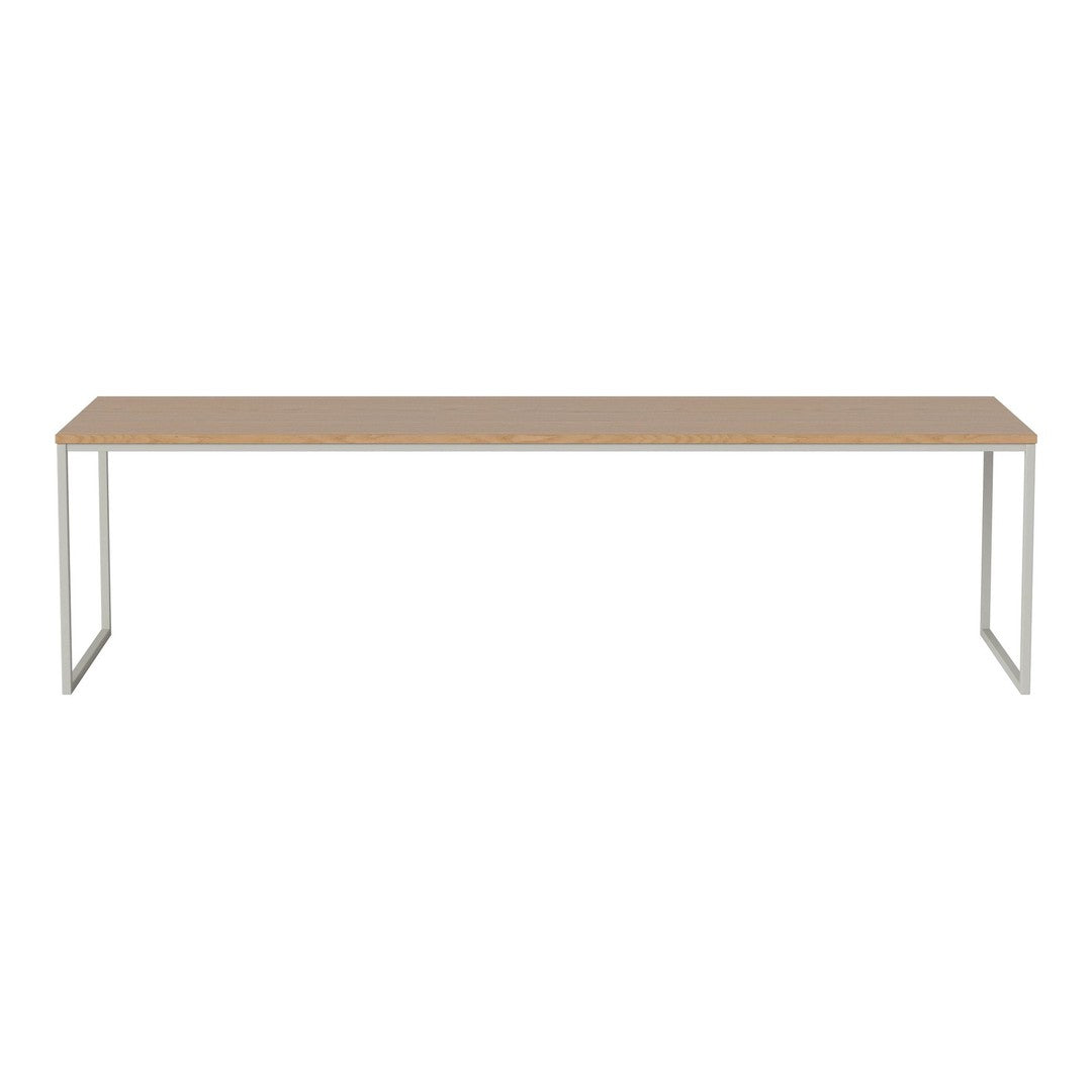Light wood tabletop with a smooth finish and sleek silver metal legs, minimalist design perfect for modern decor.