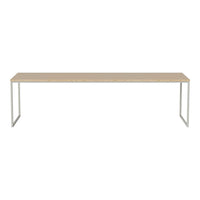 Light wood tabletop with a smooth finish and sleek silver metal legs, offering a minimalist and modern design.