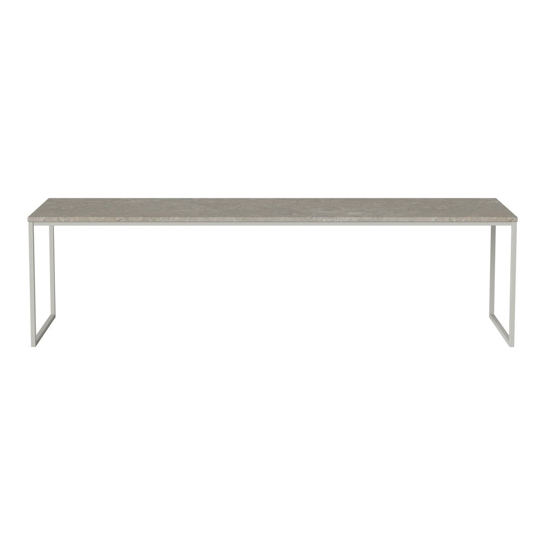 Gray rectangular table with a smooth surface and minimalist metal legs, ideal for modern decor.
