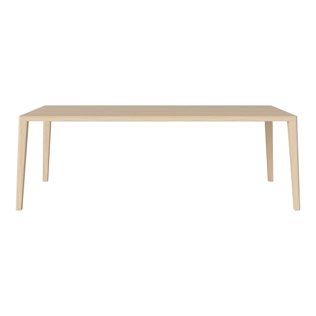 Light wood dining table with simple design, featuring smooth, natural grain and subtle beige tones. Ideal for modern decor.