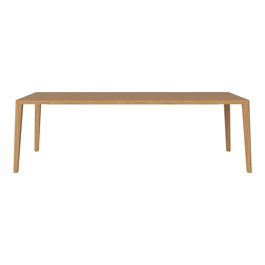 Natural wood dining table with a light oak finish and sleek, minimalist design.