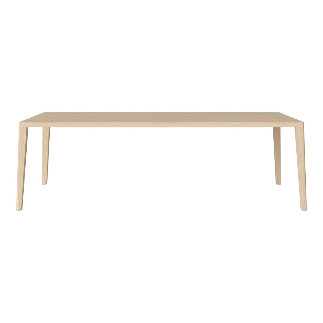 Light beige rectangular table with smooth, solid wood finish and minimalist design, perfect for modern decor.