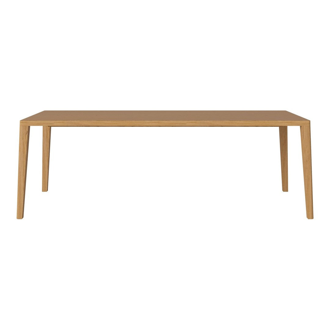 "Light oak dining table with a sleek, minimalist design and smooth, natural wood finish."