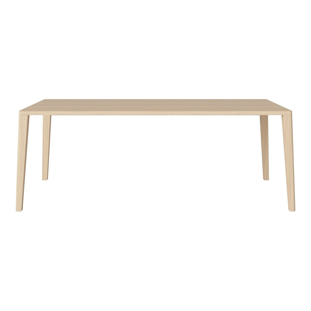 Light beige rectangular table with a sleek, minimalist design and smooth, solid surface. Ideal for modern interiors.